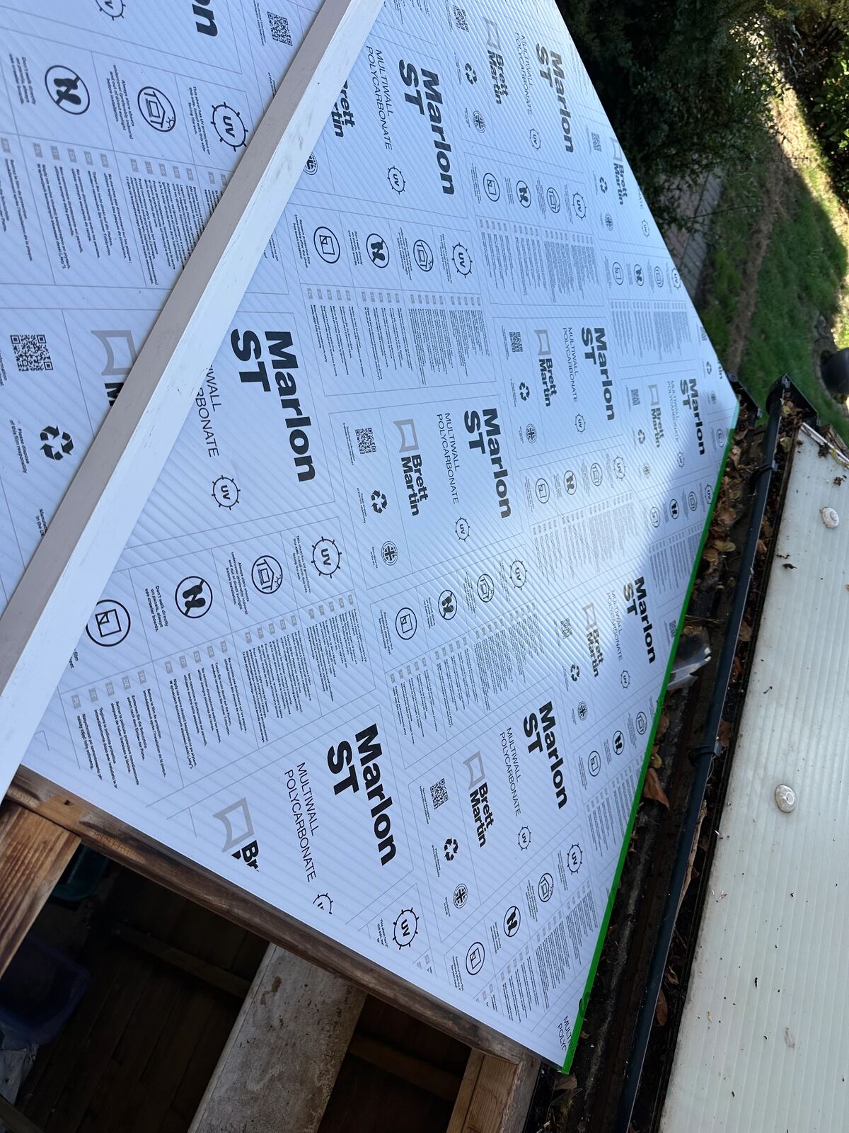 New Marlon ST multiwall polycarbonate roofing sheets still in their protective film before installation
